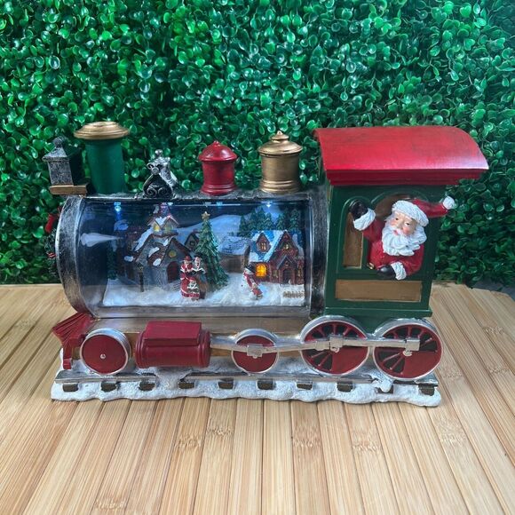 K&K Interiors 13 inch Resin LED Santa Train W/ Town...